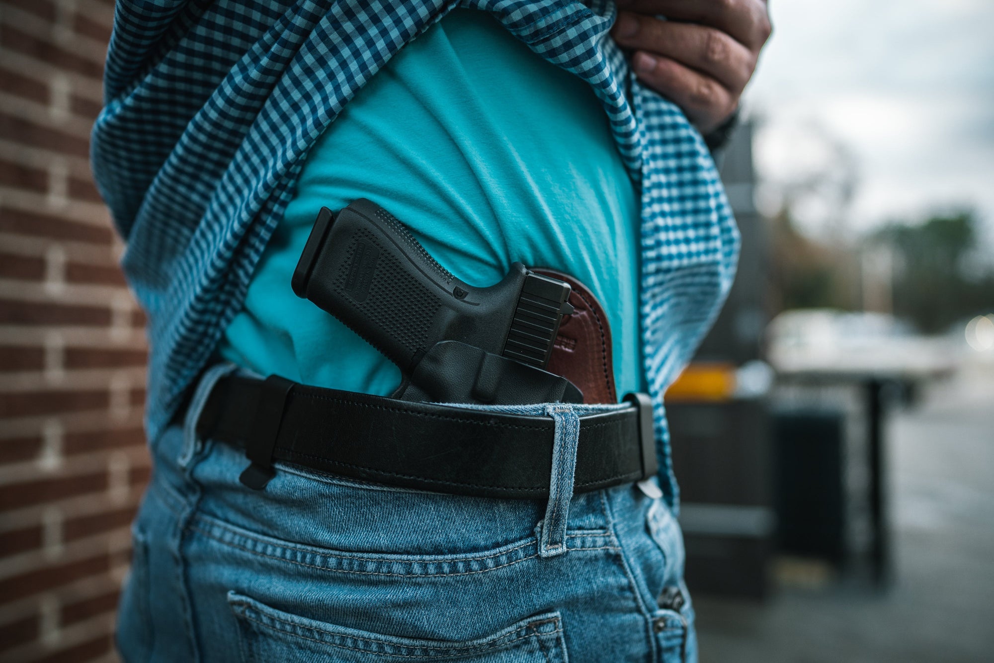 Hidden Hybrid Holsters Inside the Waist Double clip holster inside the pants on man in jeans