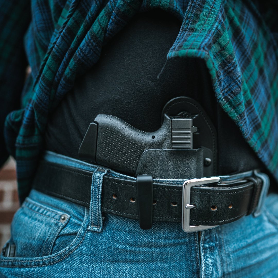 Man in Blue and Green Plaid Flannel shirt and Jeans carrying a Glock 43x in a Hidden Hybrid Holsters Inside the Waist Appendix Holster