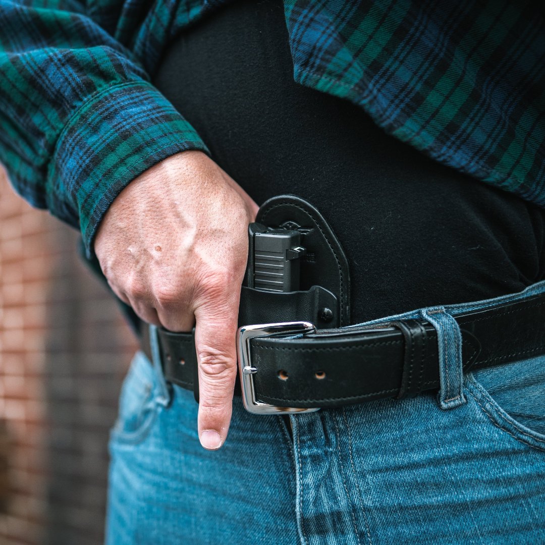 Man in Blue and Green Plaid Flannel shirt and Jeans carrying a Glock 43x in a Hidden Hybrid Holsters Inside the Waist Appendix Holster